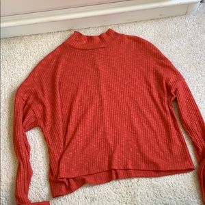 Orange turtleneck sweater